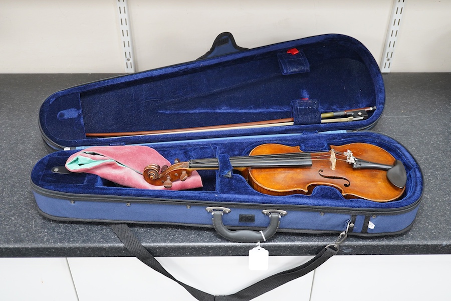 Three violins; a 3/4 Czech, a 1/2 size German and a 1/4 size Czech, all cased. Condition - fair to good